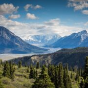 green mountain across body of water