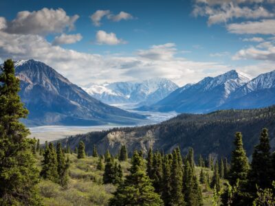 green mountain across body of water